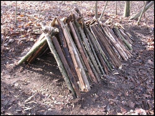 Step 6: Assemble the Ridge Pole Now simply lay one end of the ridgepole on top of the A-Frame and set the other end on top of the elevation mound. This is the foundational framework for your shelter.