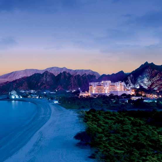 ARRIVE Set against a dramatic backdrop of rugged mountains overlooking the sea of Oman, Al Bustan Palace, A Ritz-Carlton Hotel is a breathtaking oasis situated in the midst of the business and