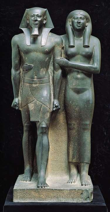 #18 Menkaure and his Queen, from Gizeh, Egypt, Dynasty IV, ca. 2490 2472 BCE. Graywacke, approx. 4 6 1/2 high.