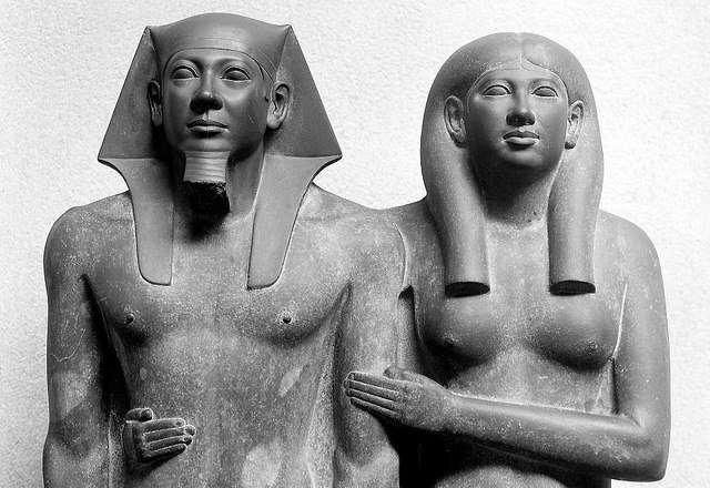 #18 Menkaure and his Queen, from Giza, Egypt, Dynasty IV, ca. 2490 2472 BCE. Graywacke, approx. 4 6 1/2 high.