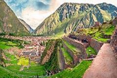 Ollantaytambo, before it finally reaches the edge of Machu Picchu. Upon arrival, have some free time to enjoy the Pisac Village Market. Have lunch in the Sacred Valley.
