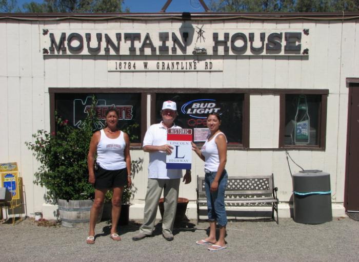 MOUNTAIN HOUSE Michael Kaelin and Gary Kinst presented the new owners of the Mountain House Bar with a Historic Lincoln Highway sign on Sunday May 18, 2008.