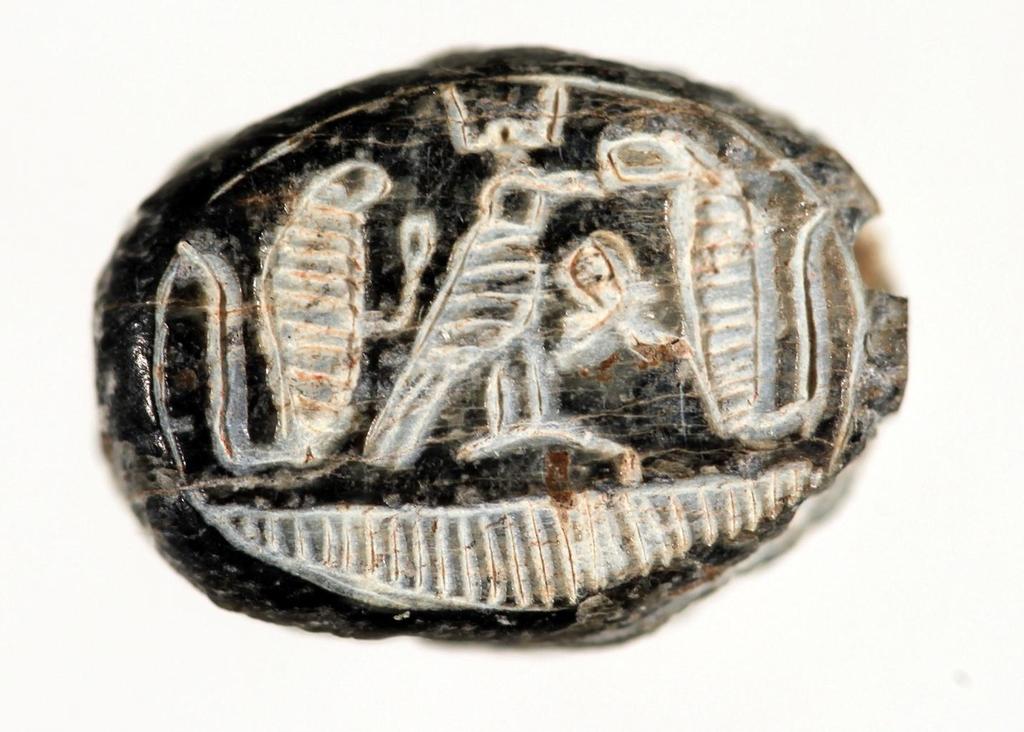 Figure 20, Scaraboid, Stratum VI, showing two aureus flanking Horus with ankh sign, locus 1122, basket 11188.