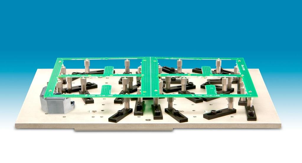 Adjustable Fixture Consists of master base plate to fit robot base with holes tapped on one inch centers 40 removable post supports attach to the base that