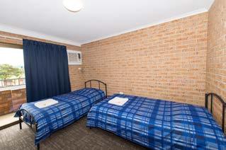 contain: 2 King single beds Private bathroom Air-conditioning Flat screen television Bar