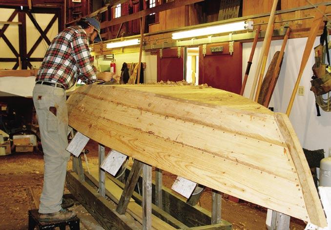 Contents Boat Yard Program Manager Bob Savage planes the bottom of the Journeyman s Special sailing skiff.