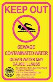 The warning sign with the yellow and black border is permanently posted near storm drains,