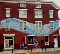 Towpath and downtown sites include three large mosaic and painted murals, numerous waysides, lockhouse and mill ruins under Potomac River bridge, and E.F. Baldwin s 1891 B&O Railroad station.