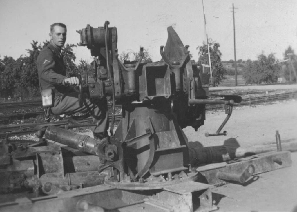 PFC Carroll Keen with German 88mm antiaircraft