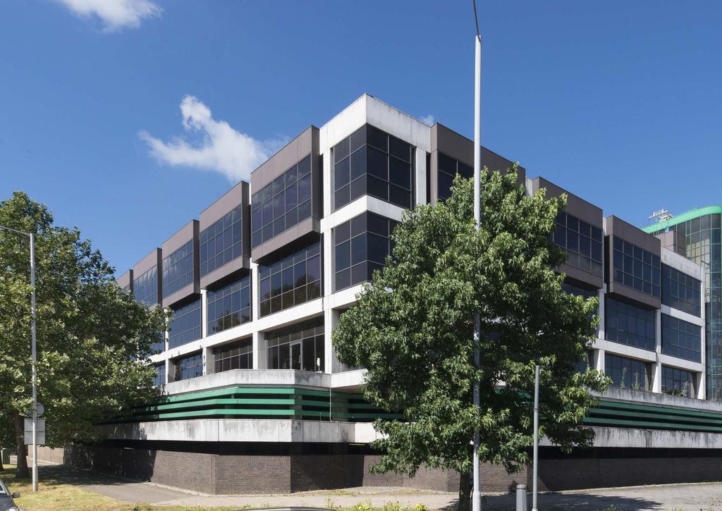 The building comprises a three storey office building with two decks of car parking fronting the Hogarth Roundabout.