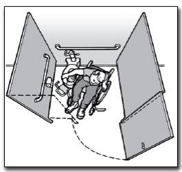 Overhead view of an individual using a wheelchair positioned beside a toilet in a wide accessible stall. H16.