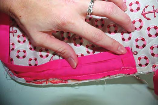 Press the seam toward the zipper/side panel. Unzip the zipper at least halfway. Repeat the previous step to attach the remaining main panel to the zipper/side panel.