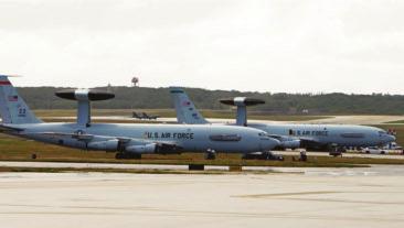 4 Awaiting its next mission, an E-3 AWACS from Kadena sits next to an E-3 from JB
