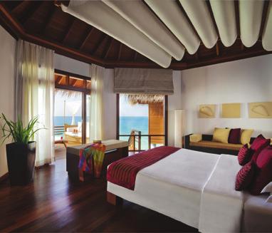 Each villa has a private pool and a daybed on a sun-soaked veranda, with a stairway descending to pristine waters below.