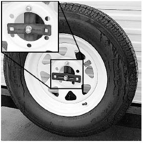 SECTION 5 RV TIRES 3. Always return the tire carrier to the upright position and lock it in place while traveling. To remove the tire from the tire carrier 1.