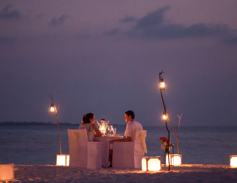PERGOLA DINNER Enjoy an exquisite five-course dinner under the comfort of a rustic beach pergola, beautifully decorated with candles and fresh flowers.