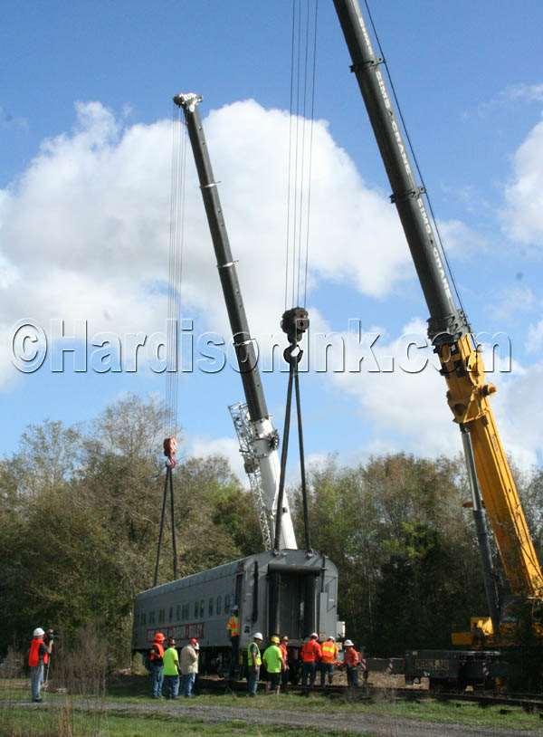 Two massive cranes were used to lift the 80,000-pound circus