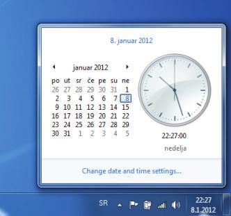Izgledi ovih prozora prikazani su na slici 2.18. Sistemsko vrijeme je prikazano u desnom uglu taskbara (notification area oglasna tabla). Klik na sistemsko vrijeme prikazaće prozor na slici 2.