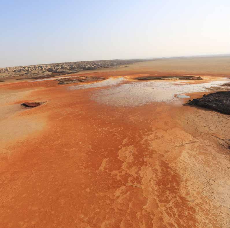 danakil depression More than 100 metres below sea level, the Danakil Depression is peppered with colourful sulphurous springs, acid lakes, active volcanoes and giant salt pans.