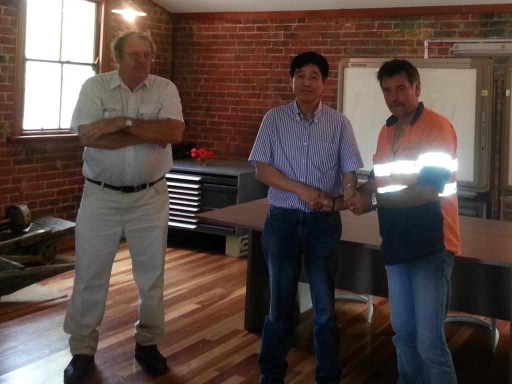 Photo 1 of 3: Jim Halloran of Kagara Ltd hands the Mt Garnet concentrator keys to Mr Tong,