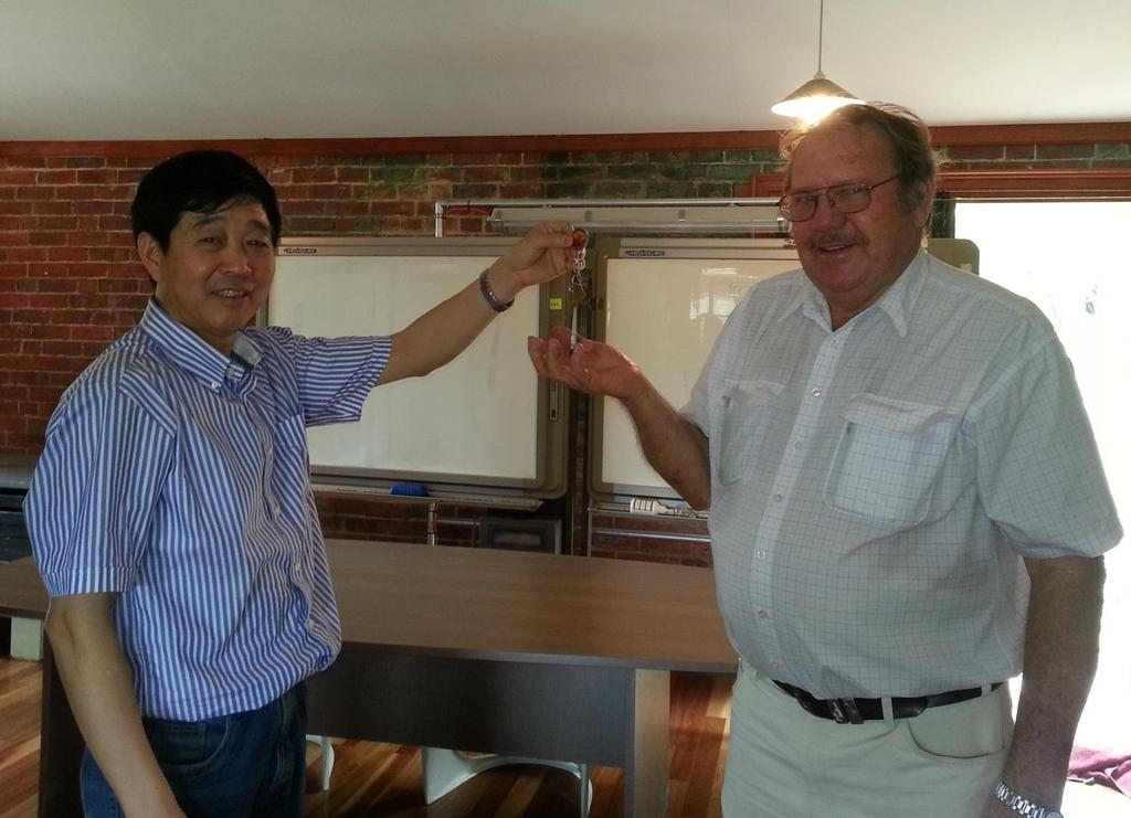 Photo 2 of 3: Mr Tong of Snow Peak International Investments hands the Mt Garnet concentrator