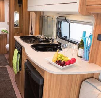 Xplore 574 with fixed twin beds leading to rear bathroom Stylish kitchens with plentiful storage Modern spacious bathrooms with Rapid-heat Whale water heater and blown air
