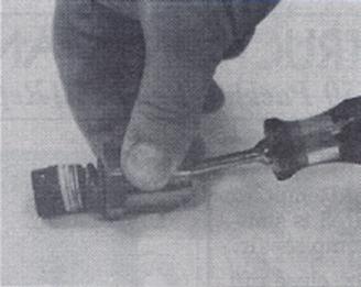 Holding the valve s shaft firmly in place, pry out the gland with a screwdriver, Figure 3. 6.