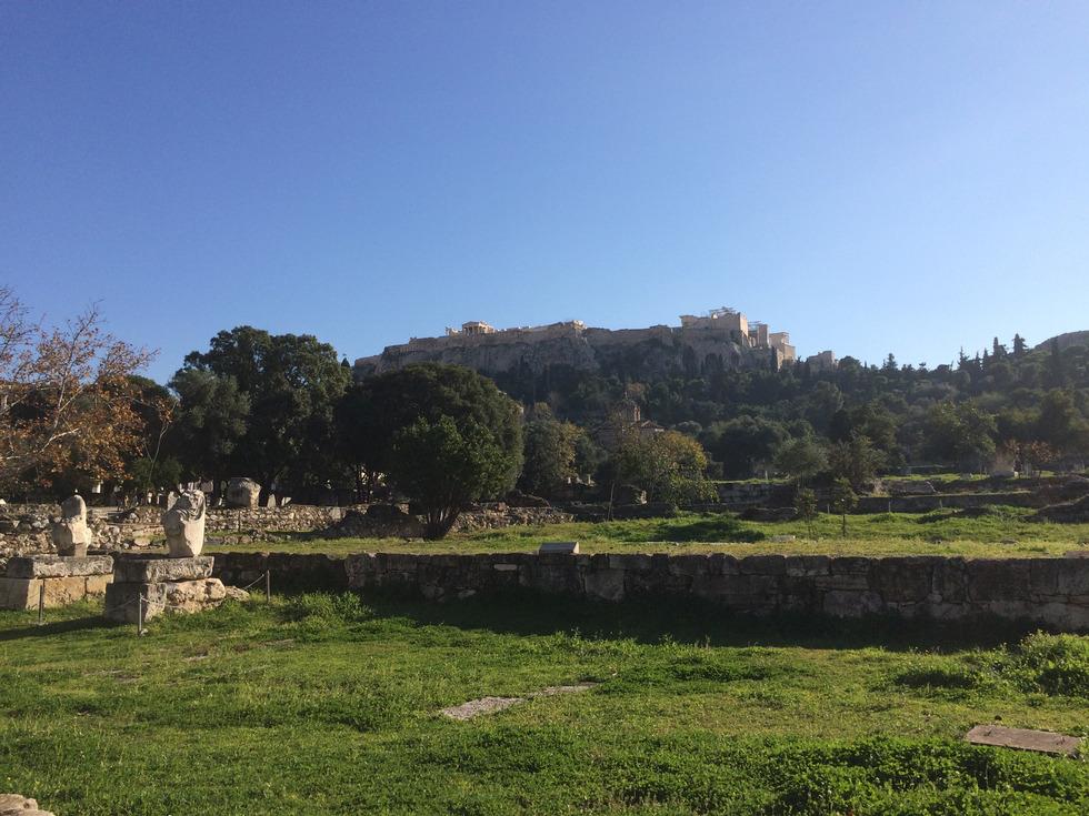 At the base of the Acropolis is the Agora. The Agora is the marketplace of ancient Athens.