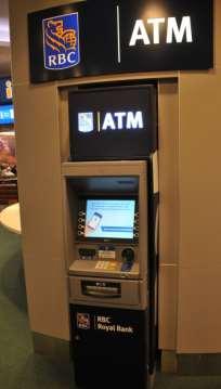 Exchange & an ATM that dispenses Canadian Currency Walk Straight ahead to Taxi Stand &
