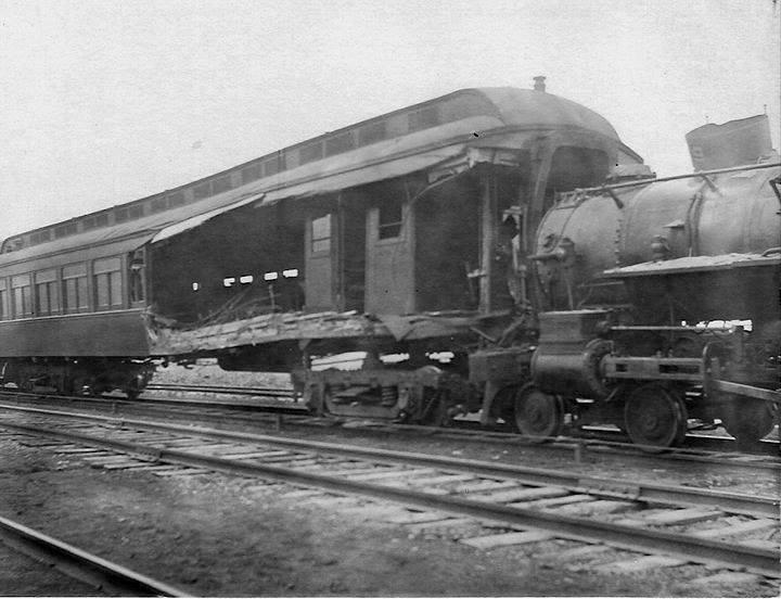 No. 69 the northbound locomotive and the severely damaged southbound smoker have been pulled back to a siding. The wooden coach s interior was pealed open by its collision with No. 69. COACH RIPPED OPEN.