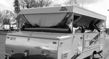 JAYCO TOWABLE SECTION 4 - TOWING & SET-UP Step 9 Slowly begin to lower the Roof (see step 3). Stop periodically to insure the tent material is tucked inside the unit.
