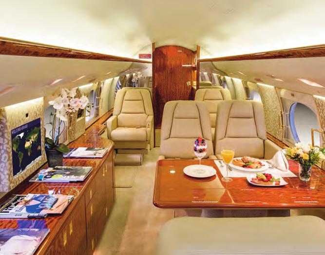 Mid/Aft-Cabin Features Two Aft Facing Club Chairs with Executive Tables, Four Place