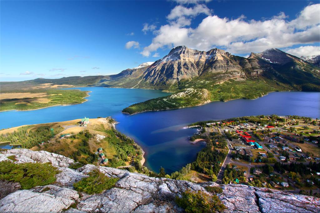 Journey to Waterton Lakes National Park, explore the UNESCO world heritage site Banff National Park and ascend by gondola to the summit of