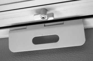 door latch at the top center of the door and slowly lower the door in place.