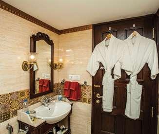 comfort during your journey. Colonial Suite bathrooms offer spacious showers with premium toiletries, robes and bath linens.