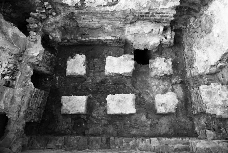 covered on top with slabs of stone (nine such slabs were preserved in place). From there, the waste water ran through channel Q9 to the north to reach the city sewage.