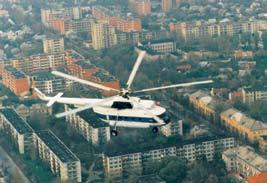 Mi-8T Šiaulių gyvenamųjų kvartalų fone. 1994 m. KOP sraigtasparnis Mi-8 MTV-1. 1994 m. Michailo Milio konstruktorių biure Maskvoje sukurtas sraigtaspasrnis Mi-8 pirmąjį skridimą atliko 1961 m.
