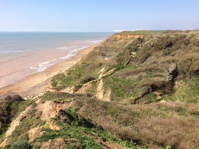 the path turns left along west side of Chiltern Chine to return to the coast.