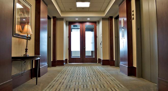 Classic architecture 6101 Carnegie welcomes visitors into a circular 2-story lobby, beautifully appointed with