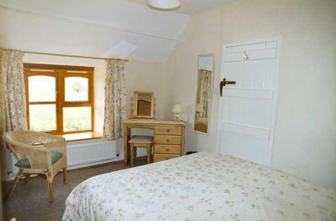 Bedroom Two has a connecting door leading to Bedroom Three.