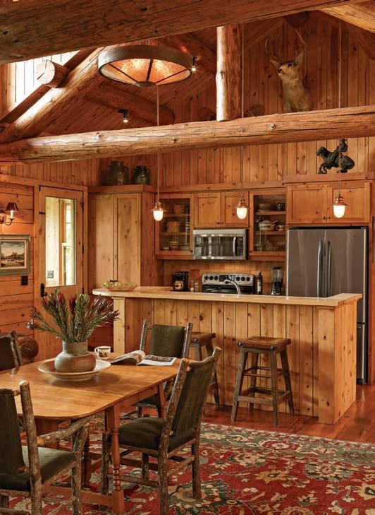 RIGHT A compact galley kitchen amidst the warmth and rustic surrounds of the wood interior