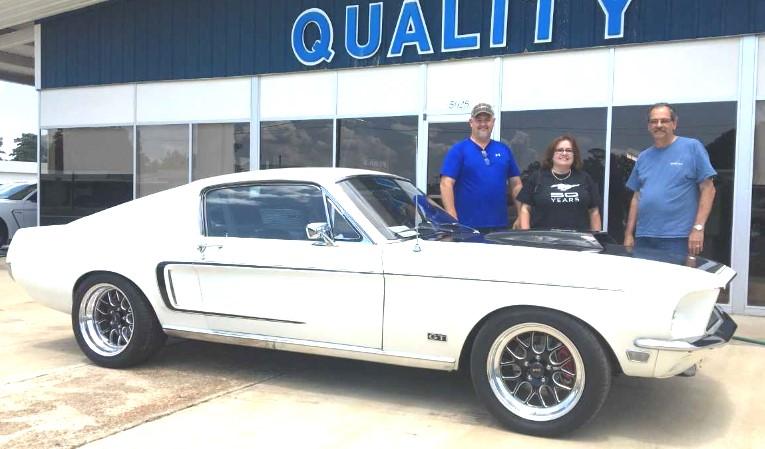 That lady is Mathilda, a beautiful restomod 1968 Ford Mustang GT fastback. The lady was purchased new in July, 1968 from Strange Motor Company in Coushatta.