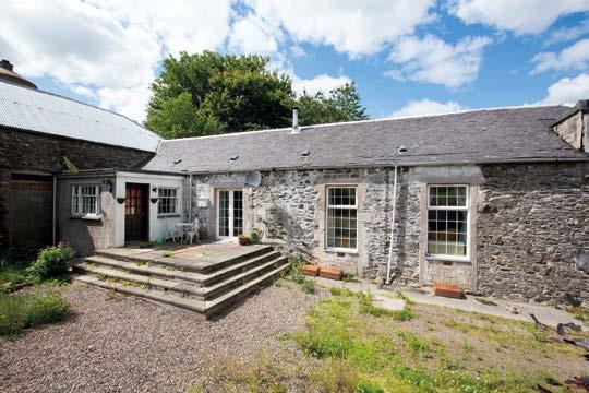 Hall, dining kitchen, living room with log burning stove, 2 double bedrooms, a bathroom and a large attic.