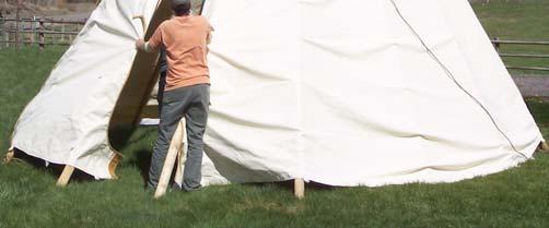 Before the tipi cover is staked it may hang about 8 from the ground.
