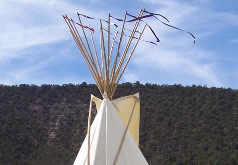 29. Now stake your tipi. Slip a stake through a peg loop (tie oversized stakes to the loops).