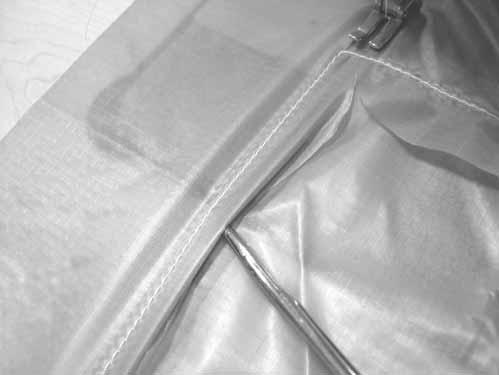 SECTION: PARACHUTE MAINTENANCE AND REPAIR TMAN-003 - MAR 2005 - REV A Place the parachute fabric behind the fold back of the
