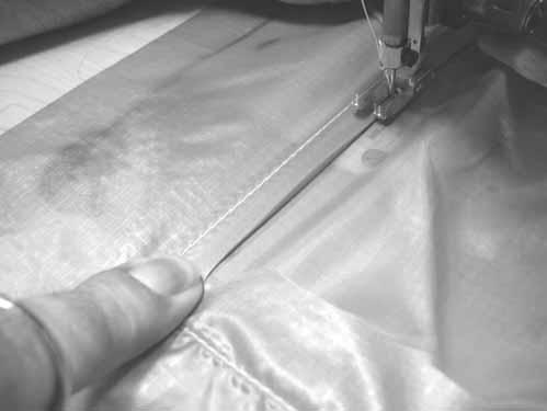 Do this in two places and seat the 1 box fold back against the patch stitch row with the tip of the hemostat.