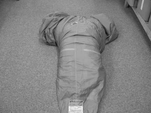 Remove the air from the parachute. S-fold the parachute as shown.