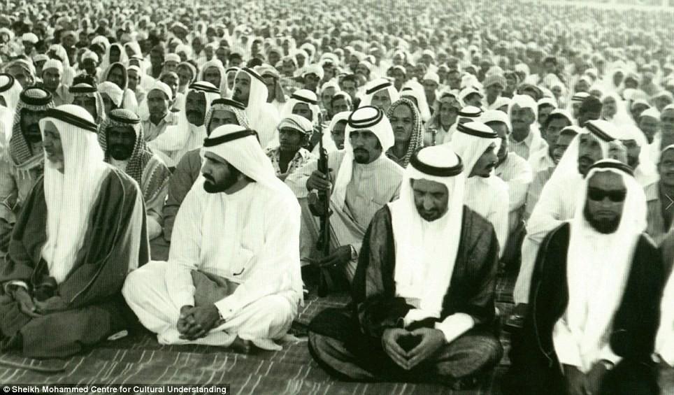Men reciting prayers for the Muslim festival of Eid in Dubai: Though the