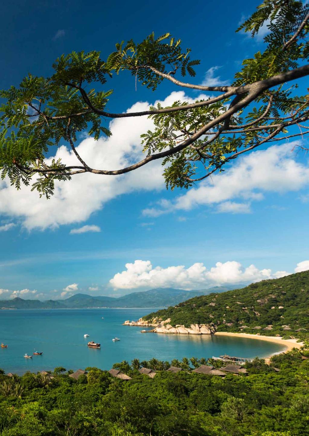 Six Senses Ninh Van Bay sits on a dramatic coral bay with golden sand and towering mountains.